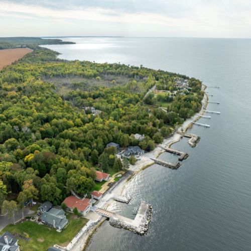 Discover the ultimate getaway at Three Leaves and the Bayside in Egg Harbor, Wisconsin. Perfect for families or small groups, this unique property features 2 charming cabins, sauna and stunning waterfront views.