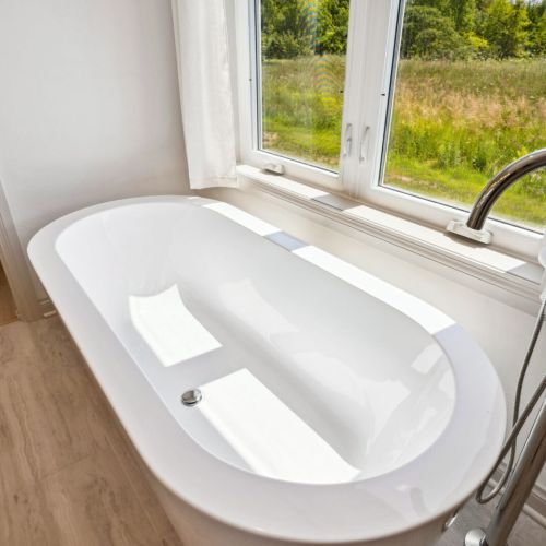 The spa-like master bath features a relaxing large soaker tub and walk-in shower.