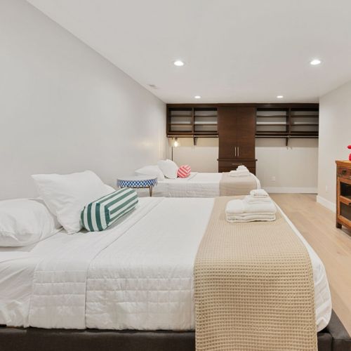The final bedroom, located on the basement level features two comfortable Queen beds.