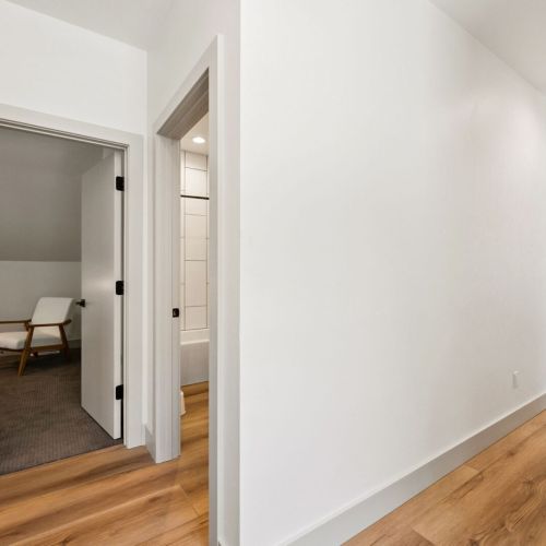 Across the hall from the bunk room, you'll find the last king-bedroom and shared full-bathroom.