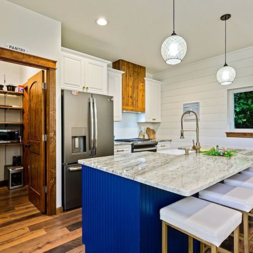 The open and roomy dining area provides the perfect opportunity to extend your gatherings into the adjacent kitchen space.