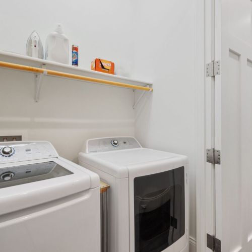 First floor washer and dryer provide added convenience  for guests during their stay.