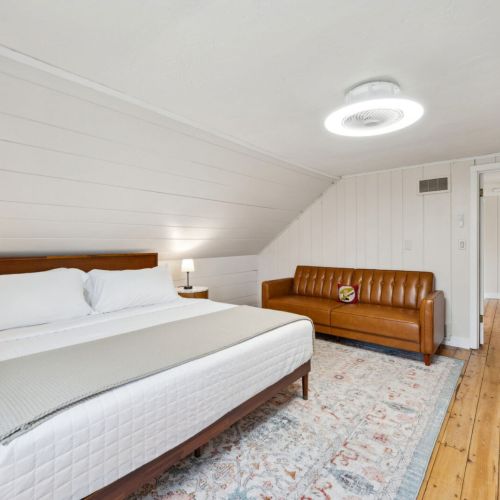 The third and final bedroom, located on the second floor of the home also features a comfortable king-sized bed and smart tv for streaming and relaxation.