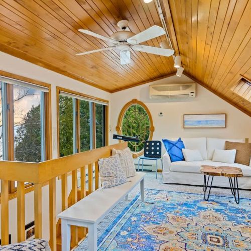 This tranquil haven features skylights and large windows that frame splendid lake views.