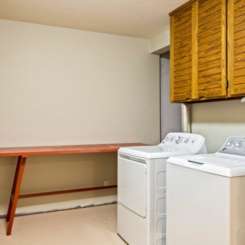 Washer and dryer located in the lower level, providing guests with convenience during their stay.