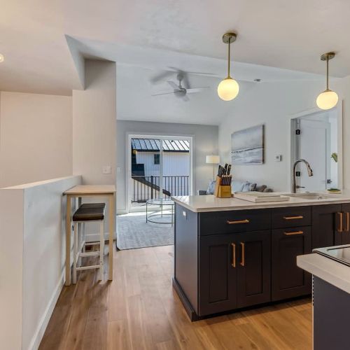 At the top of the stairs, you'll discover a private retreat featuring a fully equipped kitchen, a cozy family room, a spacious bedroom, and a full bathroom.