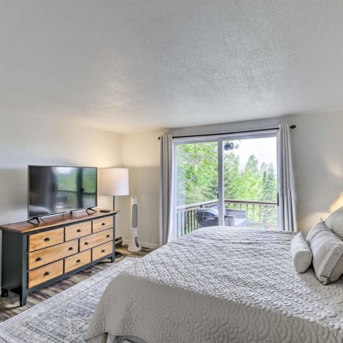 Bedroom #2 boasts a king bed with peaceful relaxation and access to the outdoor patio.