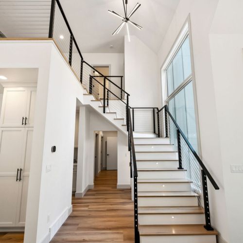 Upstairs, you'll find an additional 7 bedrooms and 4 bathrooms with second floor laundry for guest convenience.