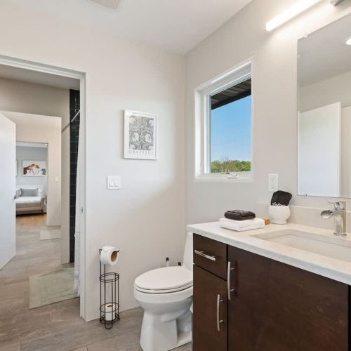 Additional half bathroom with access to jack-and-jill shower/tub combination.