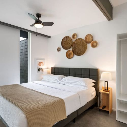 A plush king bed, organic textures, and peaceful views set the stage for truly restful nights.