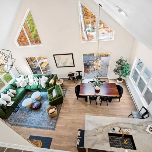 Large windows flood the space with natural light and scenic views