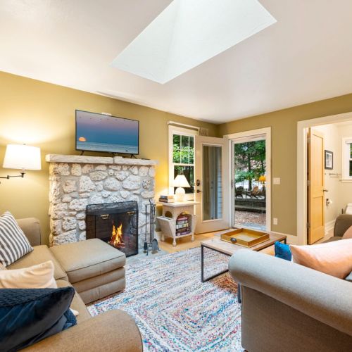 Enjoy the warmth and comfort of the stone fireplace, perfect for unwinding after a day of exploring the peninsula or spending time on the water.