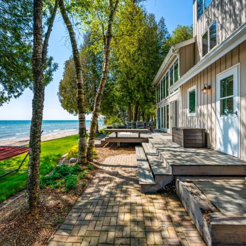 Experience the enchantment of Door County. Sandvik House is a charming 4-bed, 2-bath cottage nestled along the tranquil shores of Lake Michigan. This home offers a private sandy beachfront for memorable days under the sun.