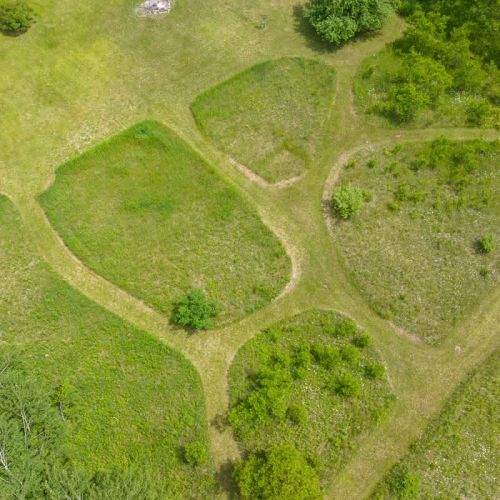 Explore the expansive grounds at Serenity Acres, complete with a fun disc golf course and beautiful walking trails. Enjoy the stunning natural surroundings and wide-open spaces perfect for outdoor activities.