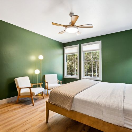 Primary Master bedroom with king bed and large en suite with shower and soaking tub.