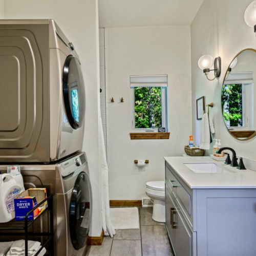 The main level full bathroom includes a stacked washer and dryer for your convenience.