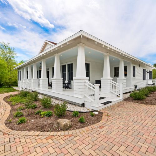 Enjoy stunning views of the secluded property on the wrap-around porch and large back patio, overlooking private walking trails perfect for the whole family to enjoy.