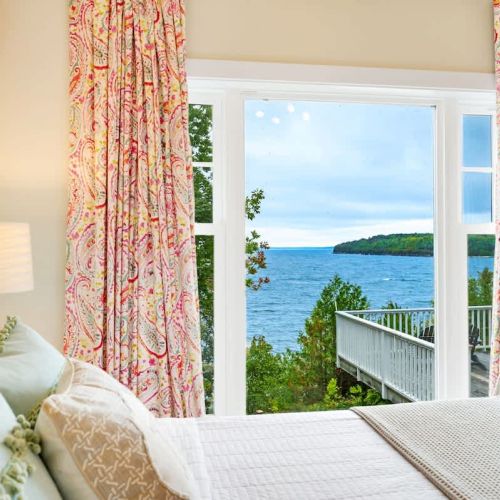 The first bedroom features a comfortable queen-sized bed and gorgeous water views.