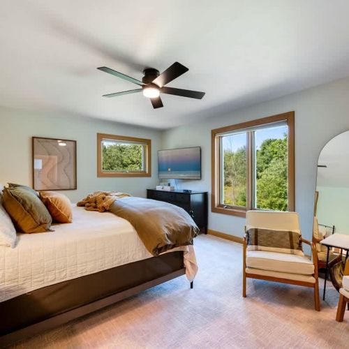 Indulge in a restful sanctuary as you sink into the plush embrace of our brand new king bed, adorned with soft sheets and plush pillows.