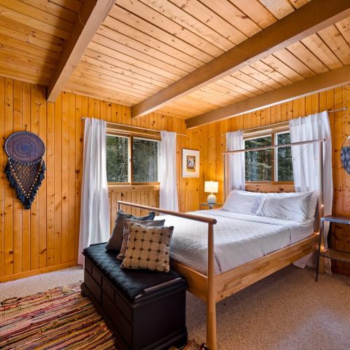 One of two bedrooms on the main floor, this one features a full-sized double bed and hotel-quality linens.