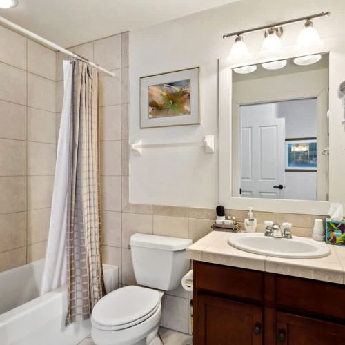 Bedroom #2 features two twin beds and an en suite bathroom.