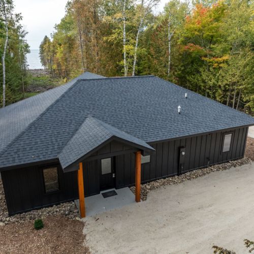 Welcome to Cedar Cove, a serene 4-bedroom, 2-bathroom retreat nestled in the woods of Egg Harbor, WI. This modern, wheelchair-accessible home offers a perfect escape for families, couples, or friends looking for a peaceful Door County getaway.