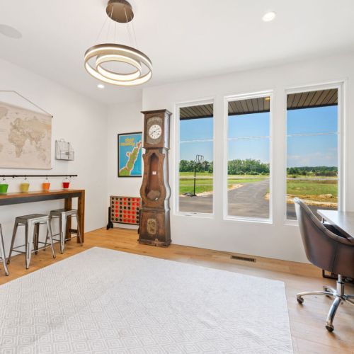 Across from the primary suite, a dedicated work space for adults or kids provides separation for work or art projects.