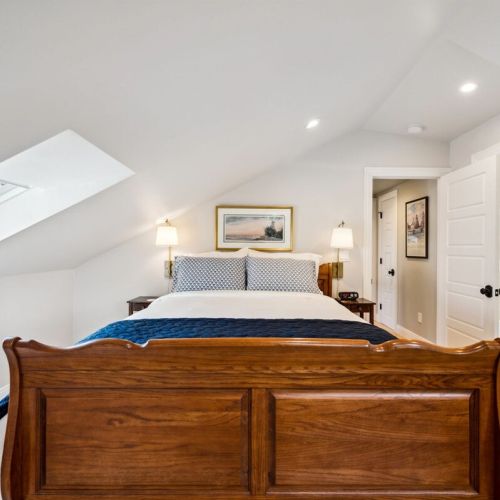 Our second-floor Queen suite is cozy with its own ensuite bathroom, Roku TV, built-in clothing storage, and closet.