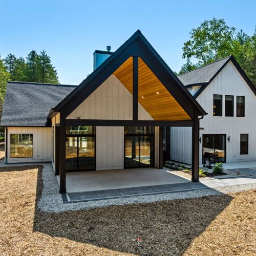 Outdoors, the expansive patio invites guests to relax under the trees, dine al fresco, or gather around the fire pit. With a barbecue grill, outdoor seating, and serene surroundings, it’s the perfect setting for reconnecting with friends and family.