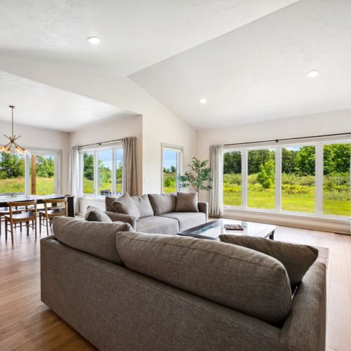 Relax in a clean and comfortable living area with peaceful orchard views just outside your window.