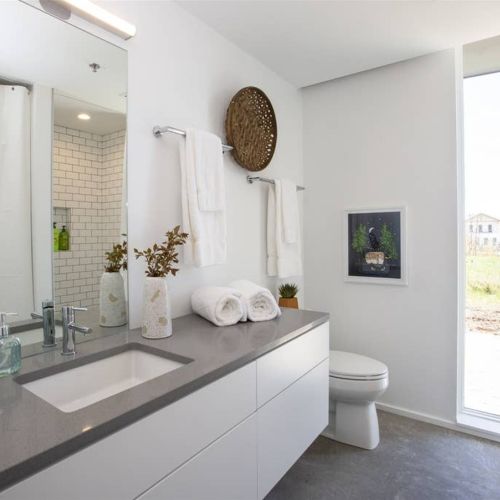 Full bathroom.  Bathroom window has a roller shade for privacy.