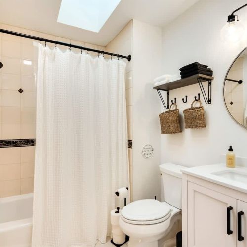 Experience the epitome of convenience in a second full bathroom, featuring a spacious shower and tub that invites you to unwind and relax.e