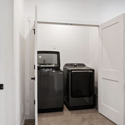 On the opposite side of the home, the washer and dryer offer guests maximum comfort and convenience throughout their stay.