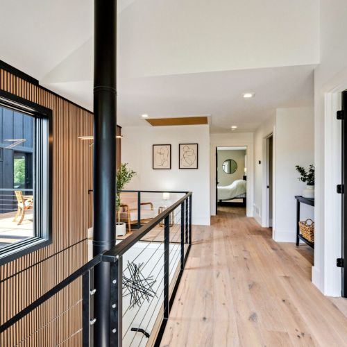 Upstairs hallway in the Main House leading to three bedrooms, laundry room and upper breezeway.