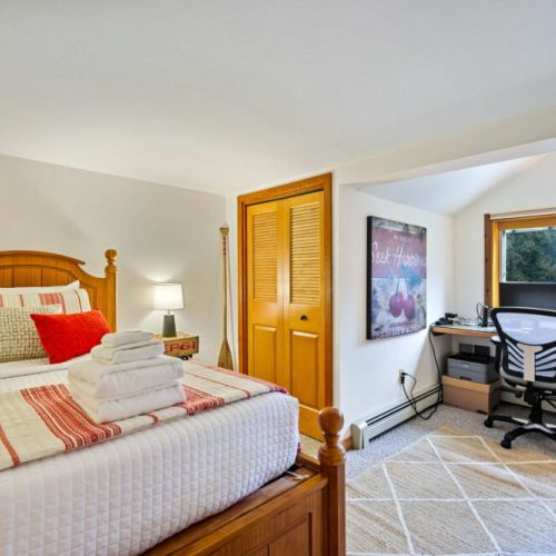 Unwind in this cozy upper-level bedroom, featuring a single bed with soft linens from the Comphy Company. For those who need to stay connected, plug into the dedicated workspace, including dual monitors and printer. All you need is your laptop!