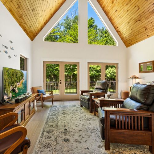 The main level features a light-filled living area where everyone can gather after a day of exploring Door County.