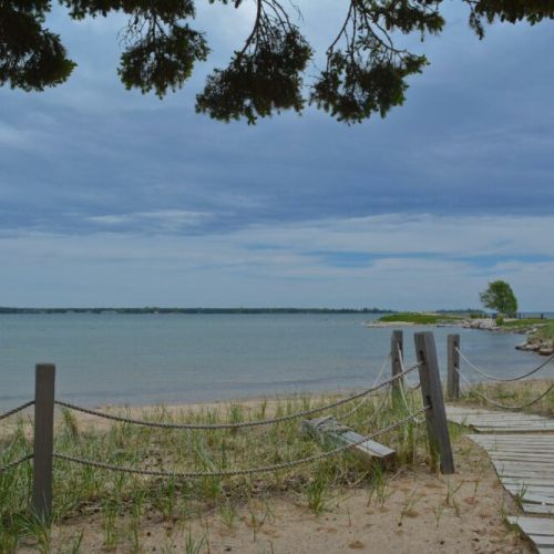 There is a public, sand beach just a five minute walk from your front door!