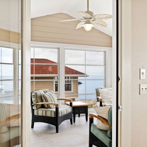 Just off the main living area, there’s a comfortable three-season sun porch, ideal for sipping your morning coffee or curling up with a good book.