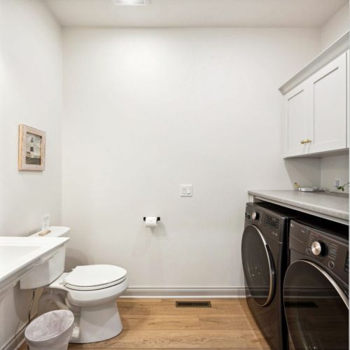 Just off the main living space is a half bath and a washer and dryer for your convenience throughout your stay.