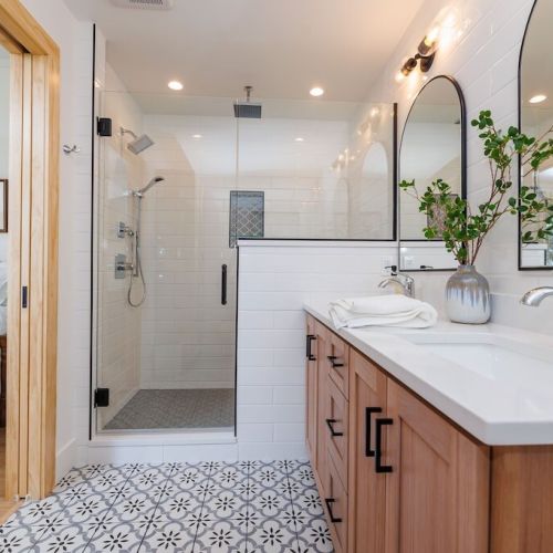 Our luxurious shower has a rain head, classic shower head, and handheld.