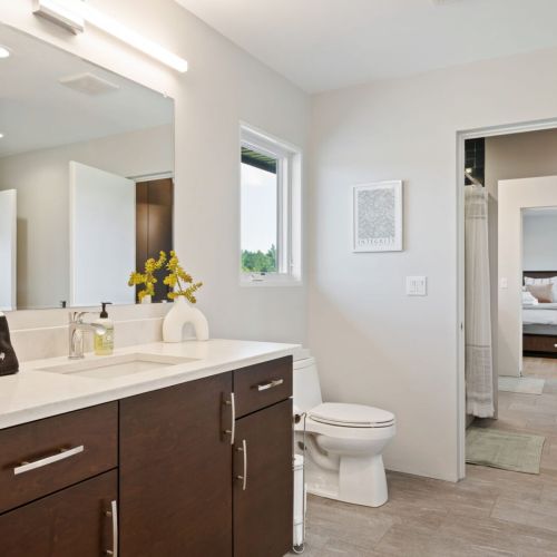 Second-floor half bathroom with access to jack-and-jill shower/tub combination.