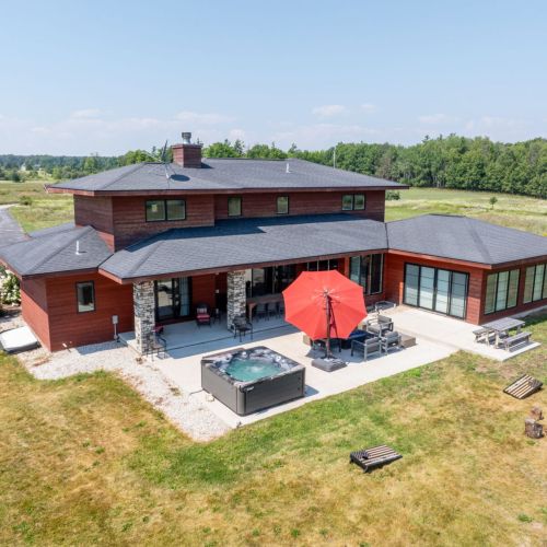 A gorgeous, spacious modern prairie-style home with 4 bedrooms, 3.5 bathrooms, and room for up to 8 guests