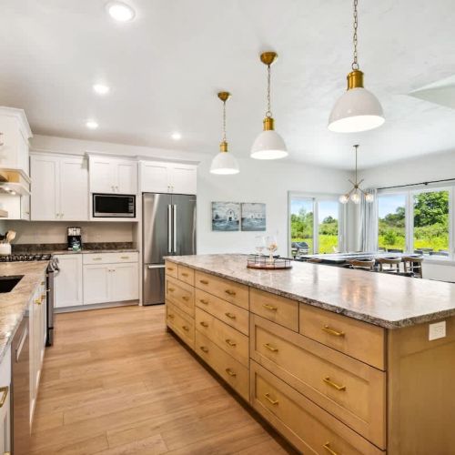 The large eat-in kitchen has all the essentials for preparing meals and snacks, and its open design makes it easy to keep the conversation going.