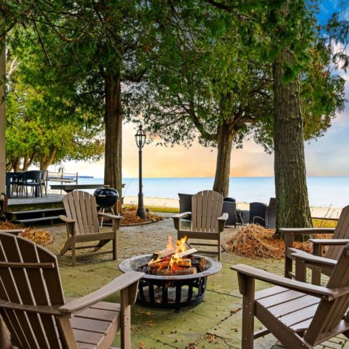Encircled by Adirondack chairs, the outdoor first pit invites guests to enjoy balmy evenings under the stars, share stories, or simply relax to the rhythmic sounds of the waves. It's an idyllic end to any day spent exploring Door County.