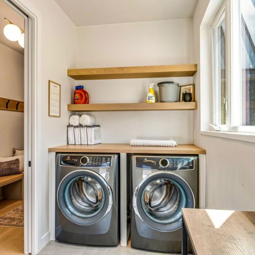 Laundry room on the first floor, off the main living space.