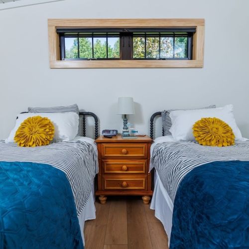 The third bedroom is small but cozy with a queen bed and a smart tv.