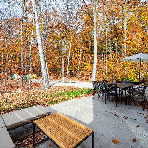 Guests have full access to the home and its 2+ acre private wooded lot. Enjoy the hammock, outdoor fire pit, and spacious patio, perfect for meals and lounging in nature.