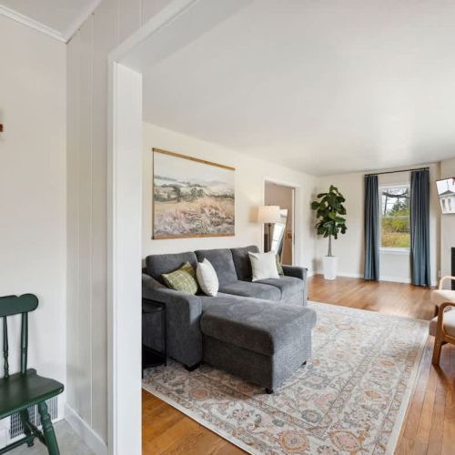 An inviting living room with Smart TV, cable, board games, and an indoor fireplace for relaxed evenings in.