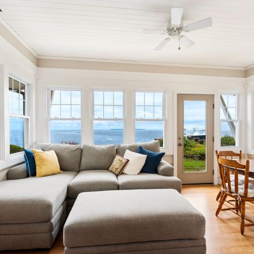 Just off the main living area, the bright and airy sun porch invites you to sip your morning coffee as the light filters through the trees or spend a peaceful afternoon lost in a book.