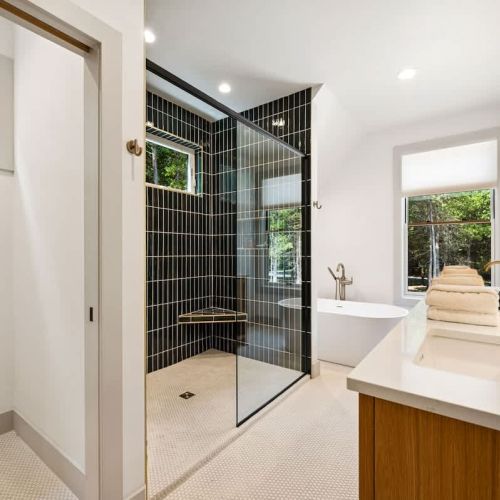 Primary Master bedroom with king bed and large en suite with shower and soaking tub.